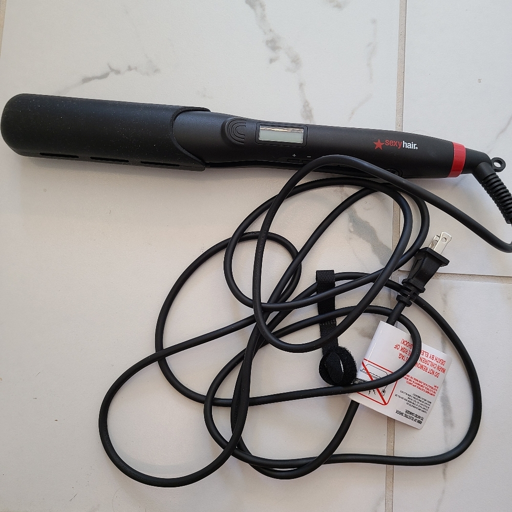 SEXY HAIR flat iron. Only used once.